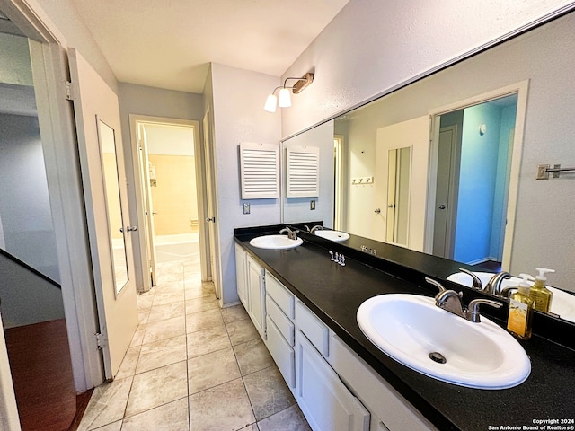 bathroom featuring tile patterned flooring and vanity