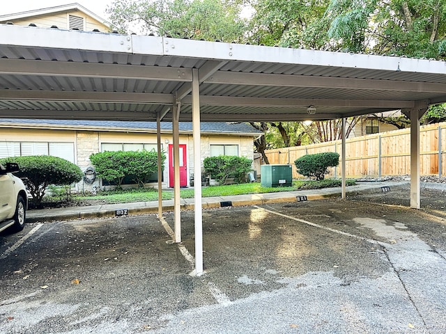covered parking lot with fence