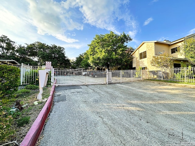 view of gate with fence