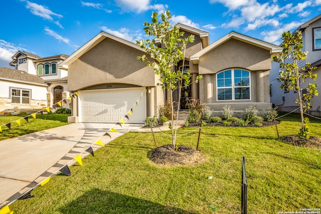 view of front facade with a front yard and a garage