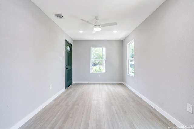 spare room with ceiling fan and light hardwood / wood-style floors