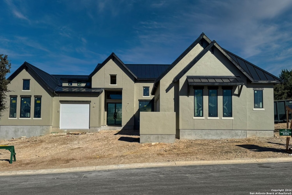 modern farmhouse style home with a garage