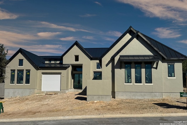 modern farmhouse style home featuring a garage