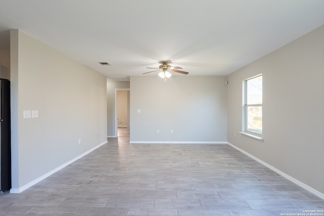 spare room featuring ceiling fan