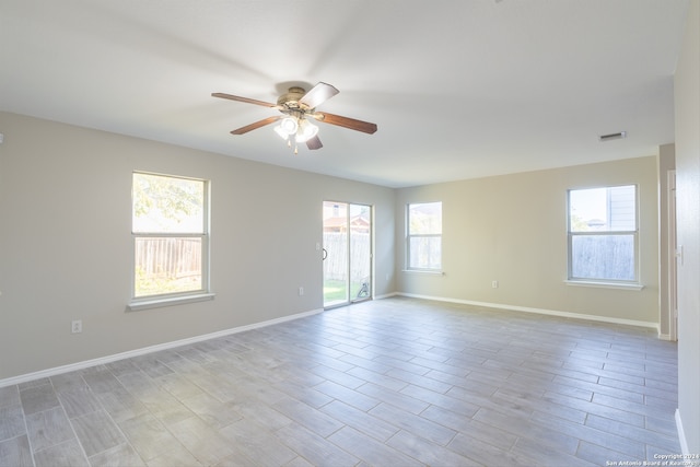 empty room featuring light hardwood / wood-style flooring and a healthy amount of sunlight