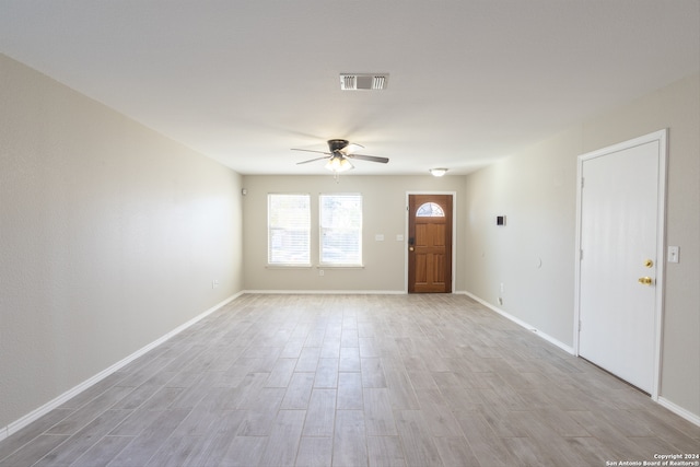 unfurnished room with light hardwood / wood-style flooring and ceiling fan