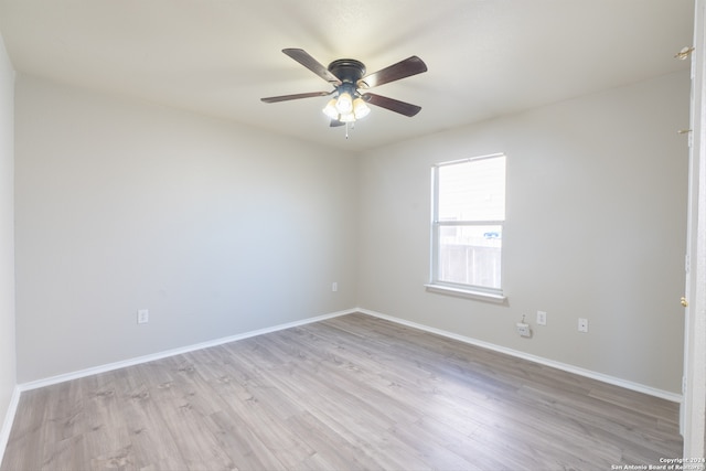 empty room featuring ceiling fan and light hardwood / wood-style floors