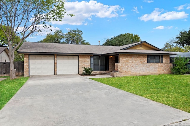 single story home featuring a garage and a front lawn