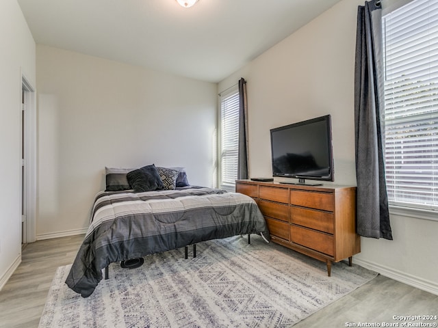 bedroom with light hardwood / wood-style flooring