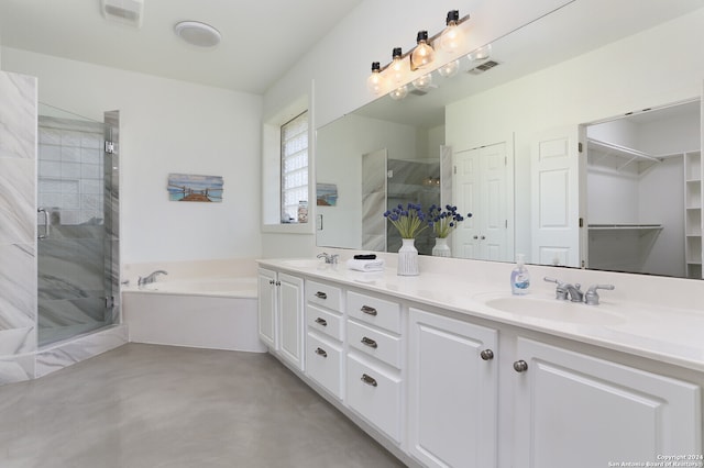 bathroom with vanity, separate shower and tub, and concrete flooring