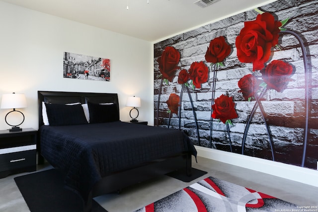 bedroom with concrete flooring