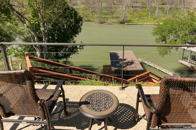 balcony featuring a water view