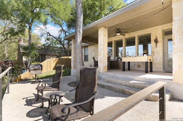 view of patio / terrace featuring ceiling fan