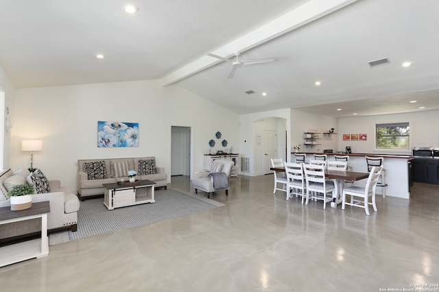 living room featuring ceiling fan and lofted ceiling with beams