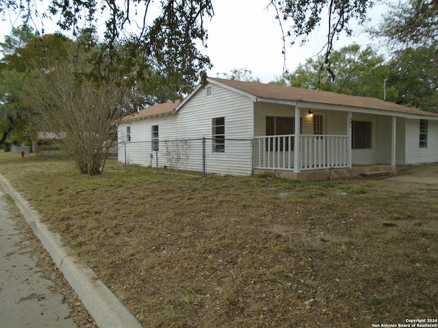 view of side of property featuring a porch