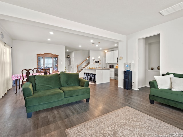 living room with dark hardwood / wood-style floors