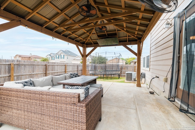 view of patio / terrace featuring a gazebo, a trampoline, outdoor lounge area, and central air condition unit