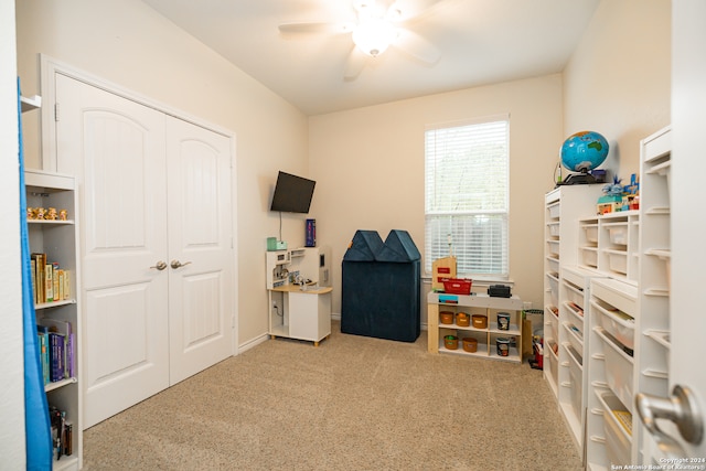 playroom featuring ceiling fan and light colored carpet