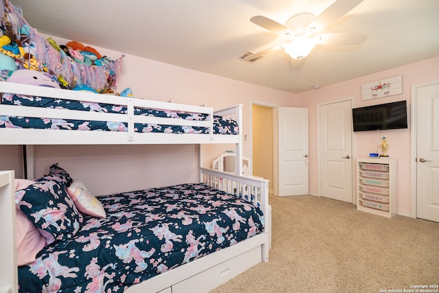 carpeted bedroom featuring ceiling fan