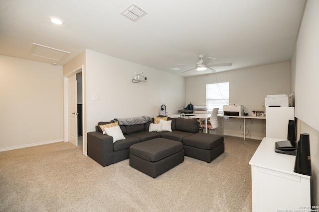 carpeted living room featuring ceiling fan