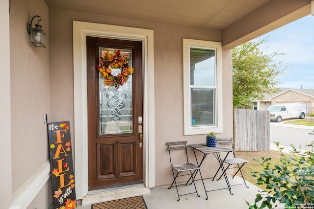 entrance to property featuring a porch