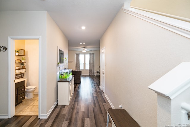 hall with dark hardwood / wood-style floors