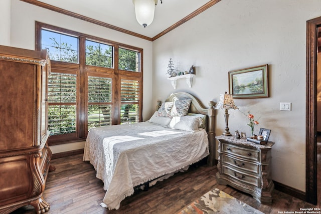 bedroom featuring dark hardwood / wood-style flooring and crown molding