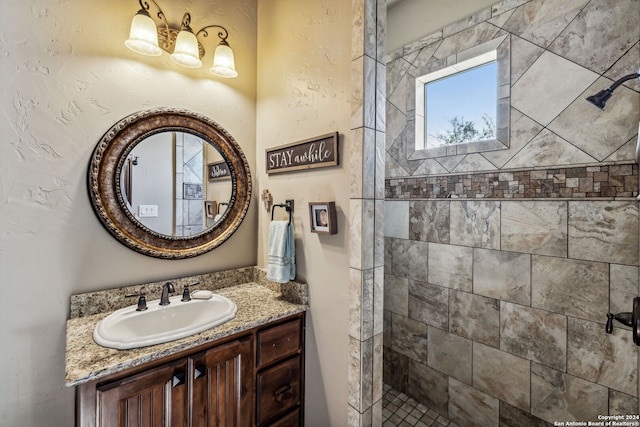 bathroom featuring vanity and a tile shower