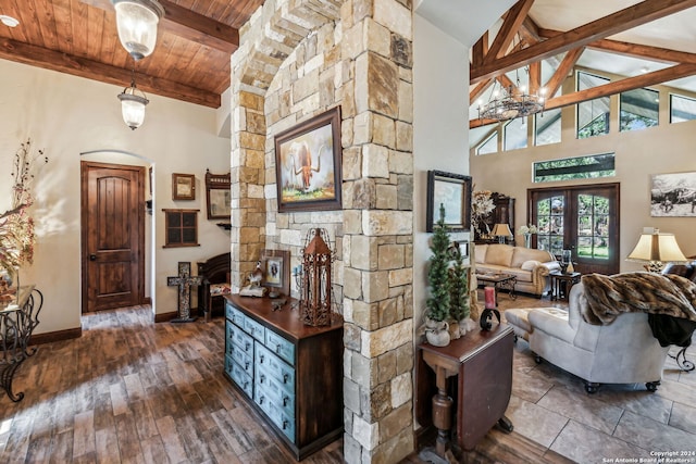 living room with french doors, dark hardwood / wood-style flooring, wood ceiling, beam ceiling, and high vaulted ceiling