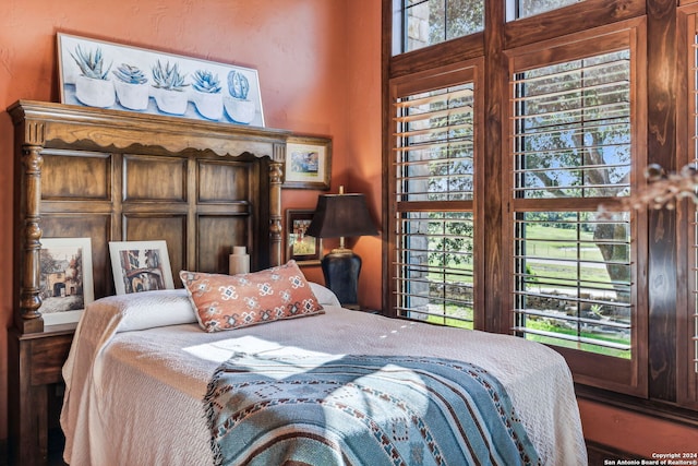 bedroom featuring multiple windows