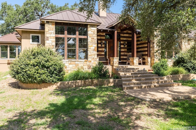 view of front of property featuring covered porch