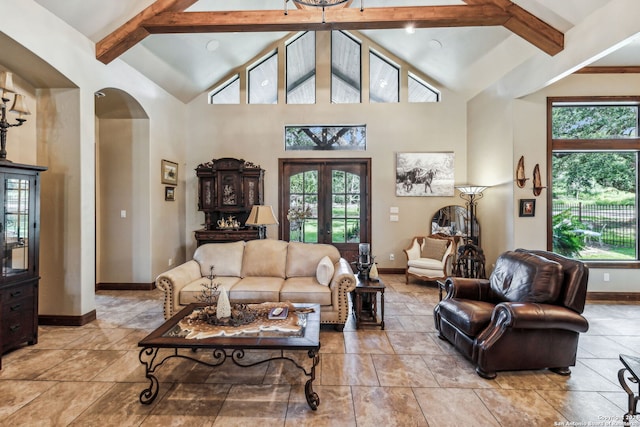 living room with beam ceiling, high vaulted ceiling, french doors, and a healthy amount of sunlight