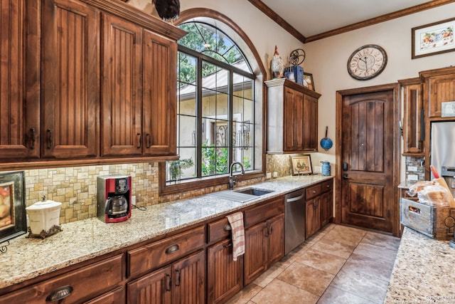 kitchen with backsplash, dishwasher, plenty of natural light, and sink