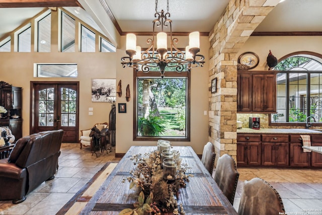 dining room with a healthy amount of sunlight, french doors, and an inviting chandelier