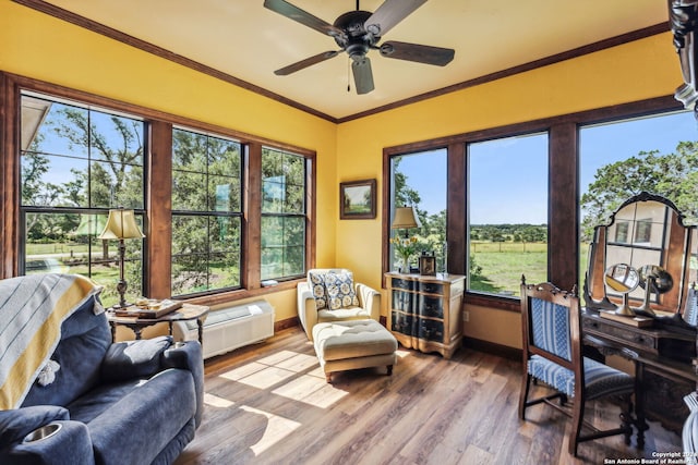 sunroom / solarium with ceiling fan