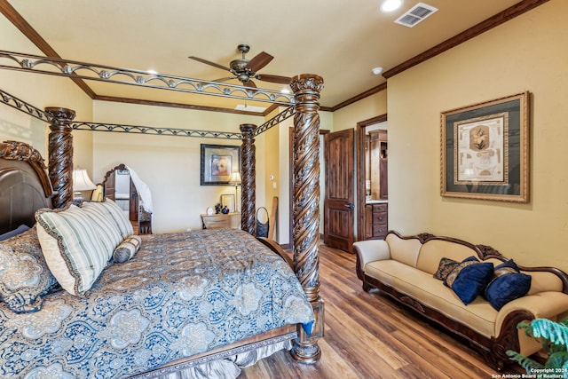 bedroom with hardwood / wood-style flooring, ceiling fan, and ornamental molding