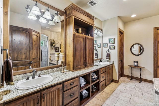 bathroom with tile patterned floors and vanity