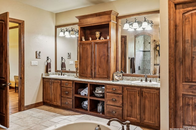 bathroom featuring tile patterned flooring and vanity