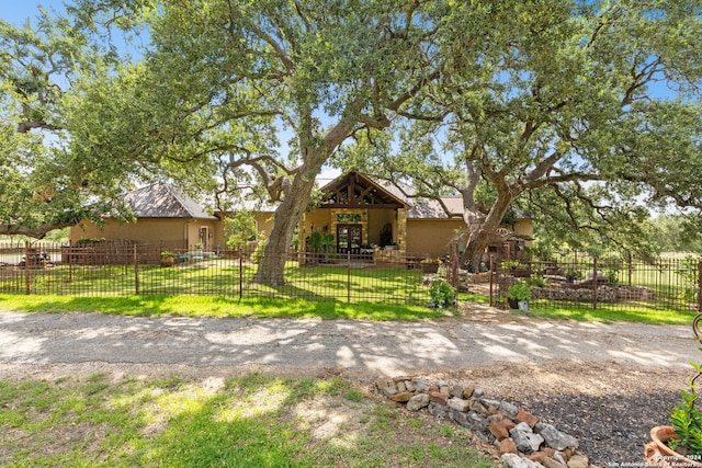 back of house featuring a yard