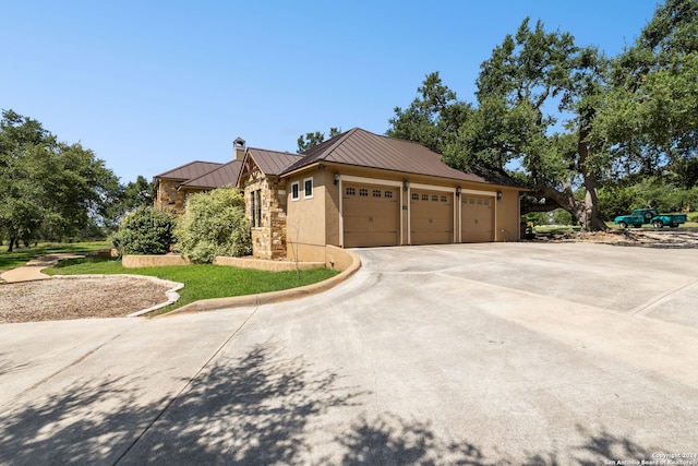 view of property exterior featuring a garage