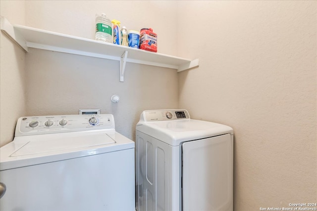 clothes washing area featuring independent washer and dryer