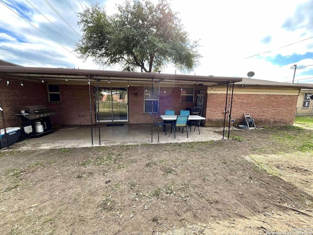 rear view of property featuring a patio