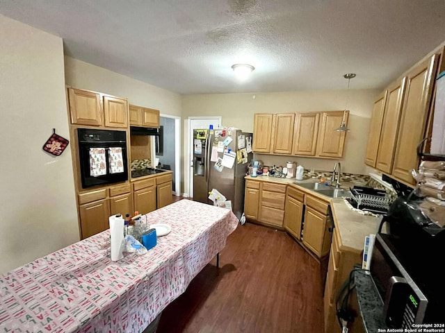 kitchen featuring decorative light fixtures, light brown cabinetry, black oven, dark hardwood / wood-style flooring, and stainless steel fridge with ice dispenser