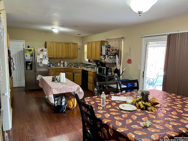 dining area featuring dark hardwood / wood-style flooring and sink