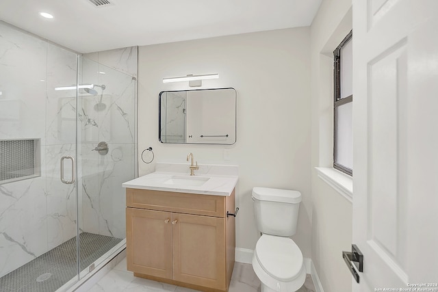 bathroom with vanity, toilet, and walk in shower