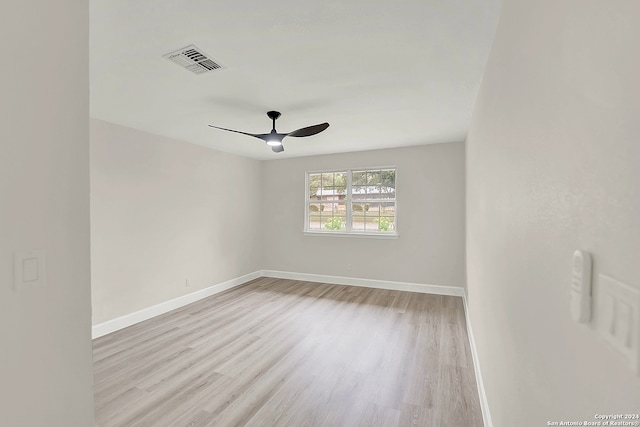 unfurnished room featuring ceiling fan and light hardwood / wood-style flooring