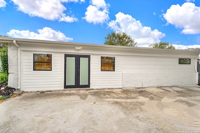 back of house featuring french doors and a patio