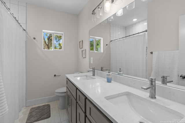 bathroom with tile patterned flooring, vanity, toilet, and a shower with curtain