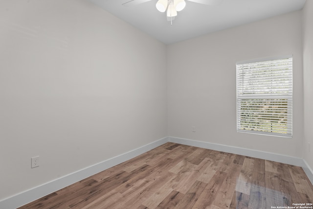 spare room with ceiling fan and light hardwood / wood-style floors