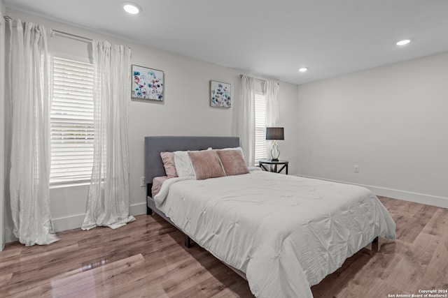 bedroom with light hardwood / wood-style floors